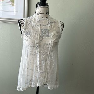 Free People sheer blouse with lace trim down front. Delicate buttons. Spring top